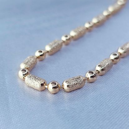 Imagen de Cadena Tejido Punto Liso y Coma Azucarada Oro Dorado