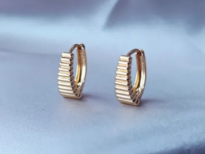 Imagen de Huggie Escalando Sueños